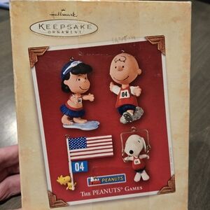 Hallmark Keepsake Peanuts 2004 Games set of 4 ornaments.